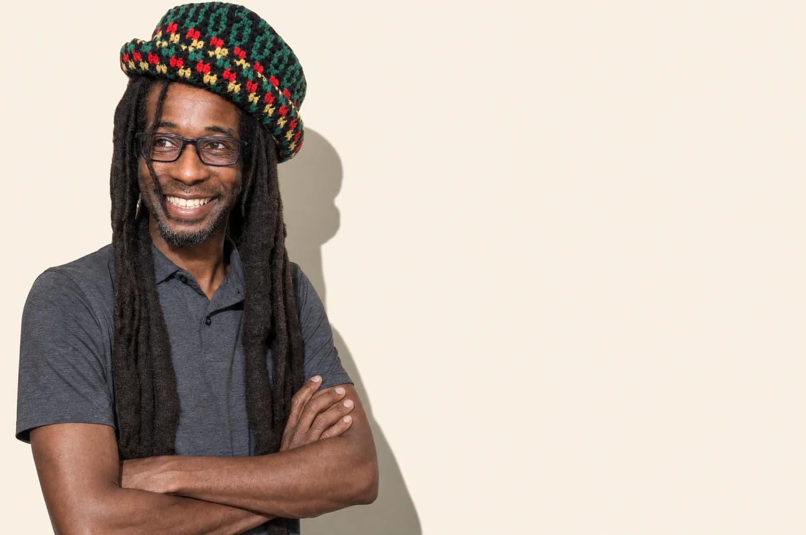 Peewee Dread, arms folded, laughing